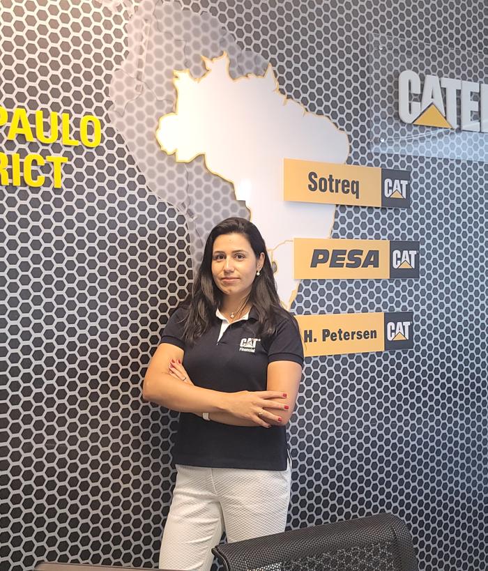 a person standing in front of a wall with a map of the state