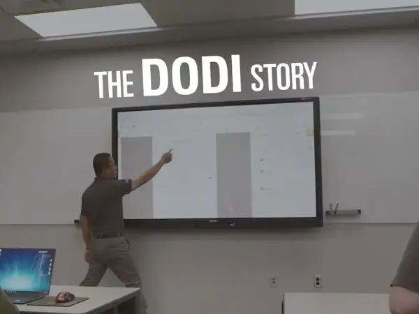 a person pointing at a screen
