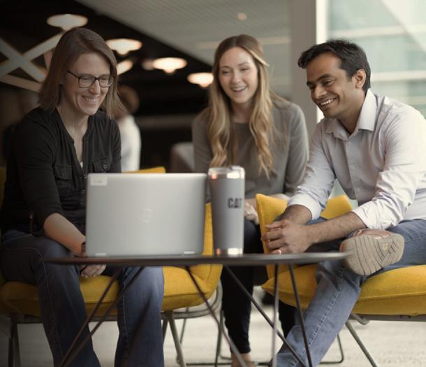 a person sitting on a chair using a laptop