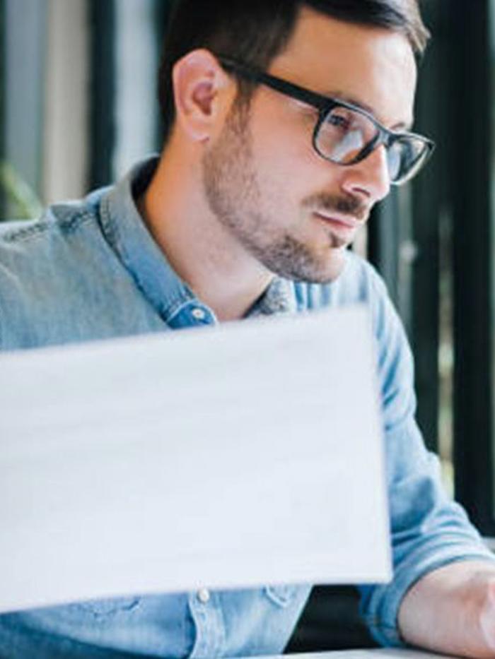 a person holding a piece of paper