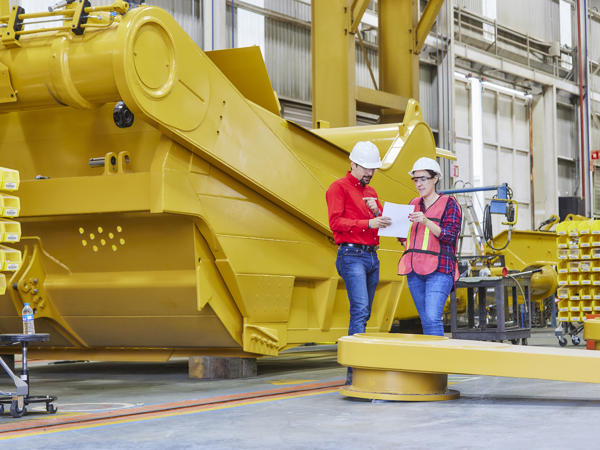 a person and person in a factory