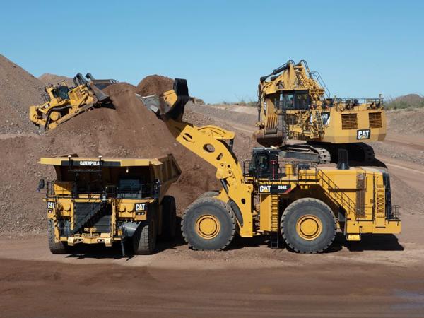 a group of yellow construction vehicles