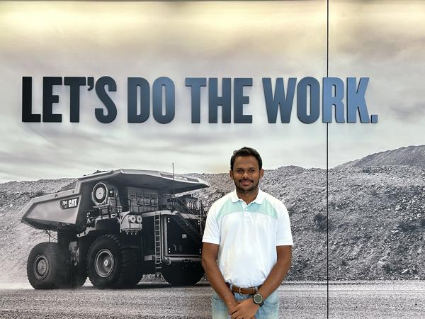 a person standing in front of a poster
