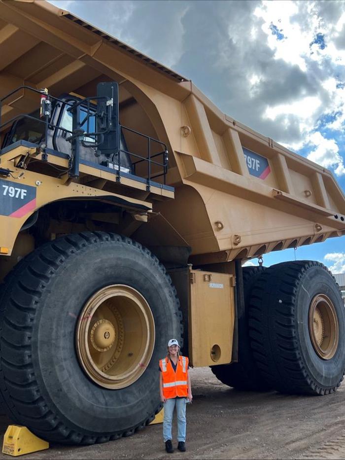 a person standing in front of a large truck