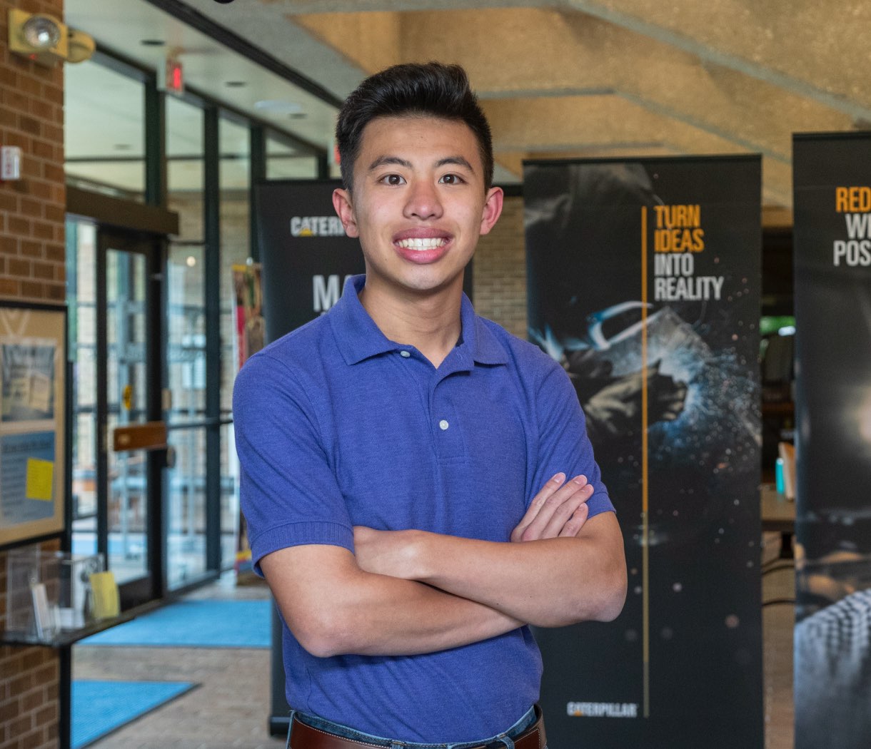 a person standing with his arms crossed