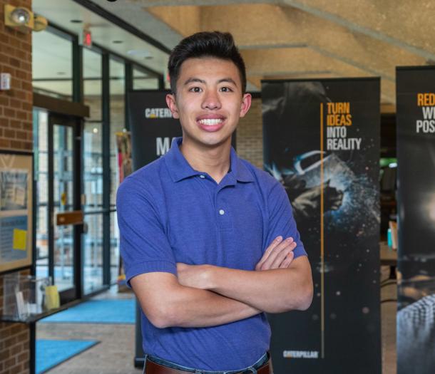 a person standing with his arms crossed