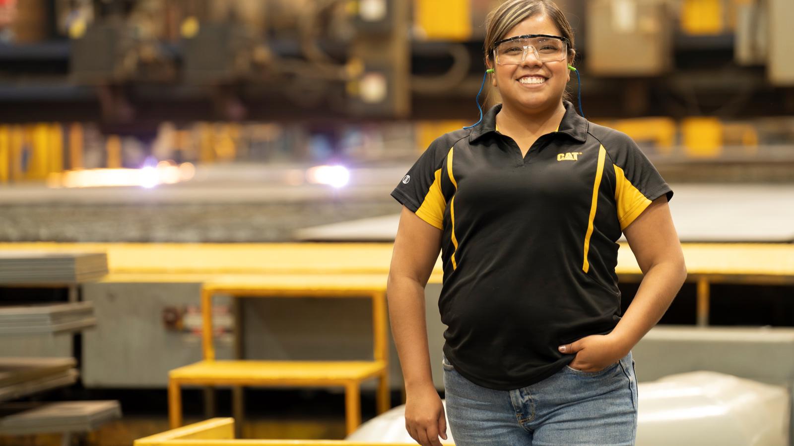 a person wearing safety glasses and a black shirt