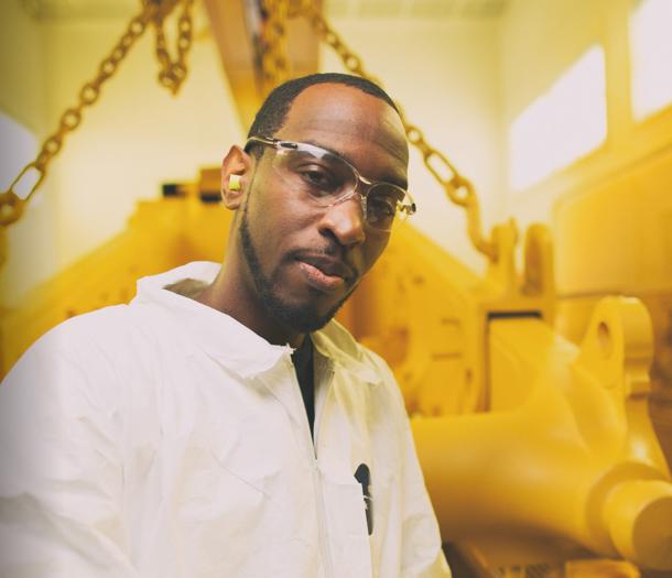 a person wearing glasses and a white shirt