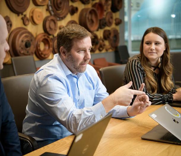 a group of men sitting at a table