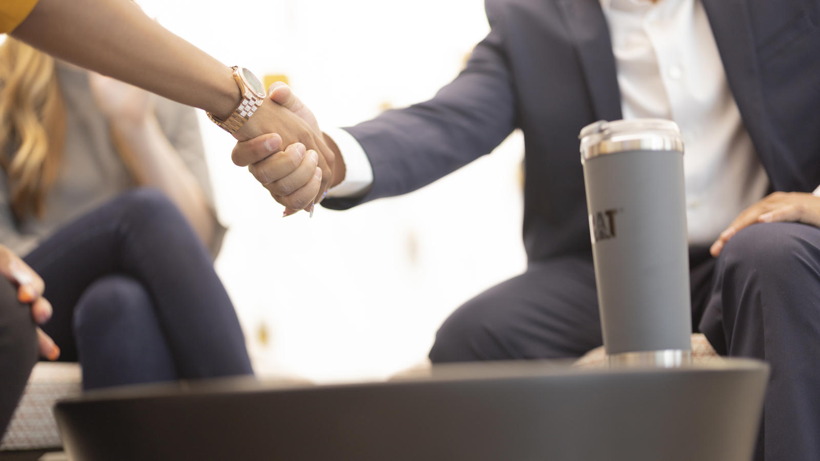 a person and person shaking hands